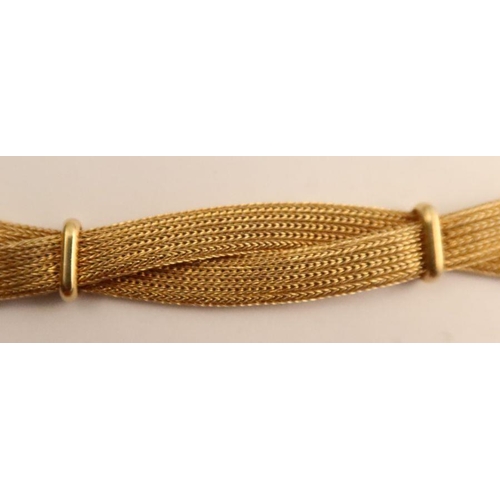 424 - An 18ct gold bracelet, formed as two twisted strands, marked 750, weight 26g