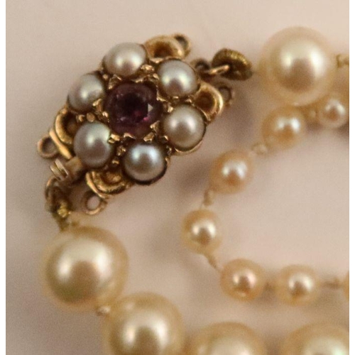 426 - A graduated cultured pearl necklace, with 9ct gold gem set clasp, together with other pearl and bead... 