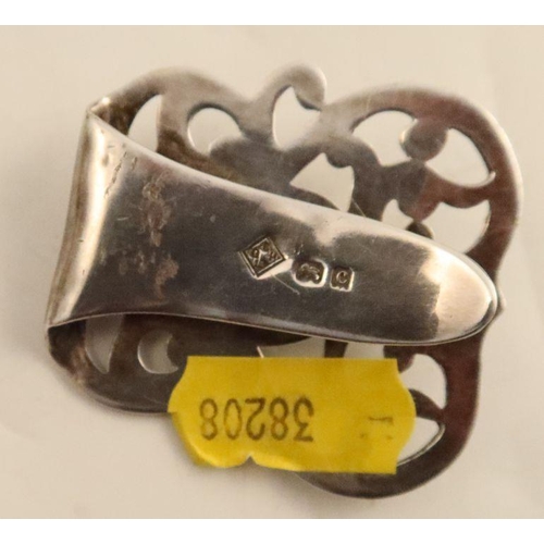 429 - A Birmingham Guild of Handicrafts silver buckle or clip, with pierced and hammered scroll decoration... 