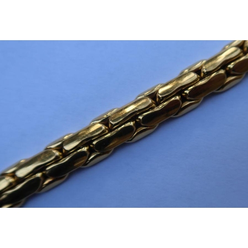 443 - An Italian gold bracelet, marked 750, weight 27g - Length 21cm, width 1cm