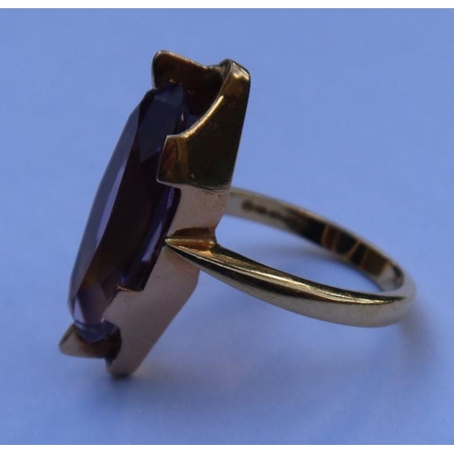 447 - A gold and amethyst ring, marked 750, total weight 7.4g