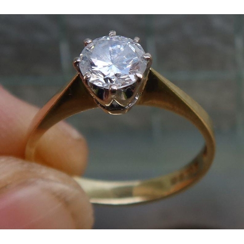 449 - An 18ct gold solitaire diamond ring, marked 750, approximately 0.9cts, weight 3.1g