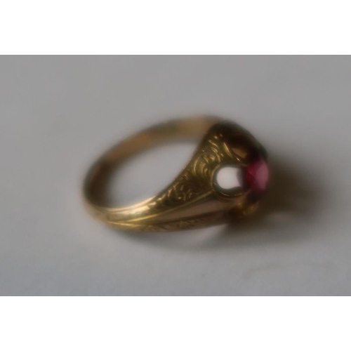 458 - A small gem set ring, with engraved decoration