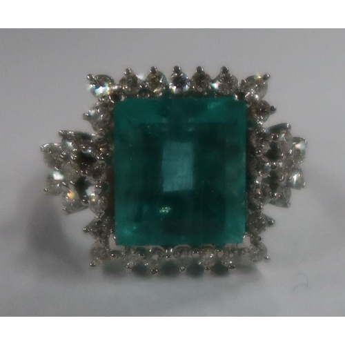 487 - An 18ct white gold emerald and diamond dress ring, the claw-set square-cut emerald approx 13.56 mm x... 