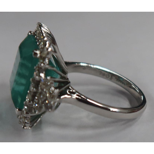 487 - An 18ct white gold emerald and diamond dress ring, the claw-set square-cut emerald approx 13.56 mm x... 