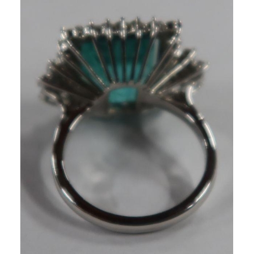 487 - An 18ct white gold emerald and diamond dress ring, the claw-set square-cut emerald approx 13.56 mm x... 