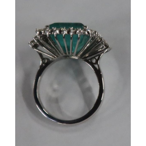 487 - An 18ct white gold emerald and diamond dress ring, the claw-set square-cut emerald approx 13.56 mm x... 