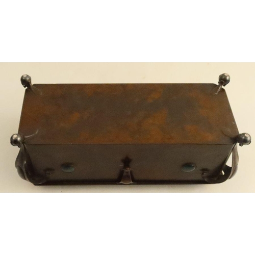 504 - An Arts and Craft copper box, of rectangular form, the top with oval enamel panel of a flower and le... 