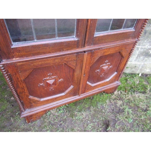 51 - An oak glazed display cabinet, width 37.5ins, height 76ins, depth 11ins