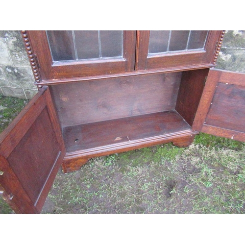 51 - An oak glazed display cabinet, width 37.5ins, height 76ins, depth 11ins