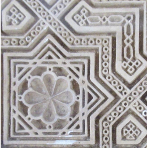 526 - An Antique Islamic terracotta tile, decorated with a shield to the center and a geometric pattern, 1... 