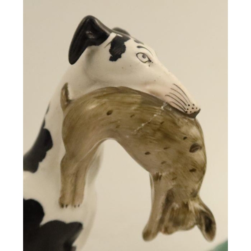 531 - A pair of Staffordshire flatback models, of black and white grey hounds with dead rabbits, height 11... 