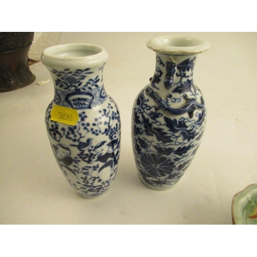 538 - A collection of oriental porcelain to include a pair of brush pots one af, a vase decorated with fig... 