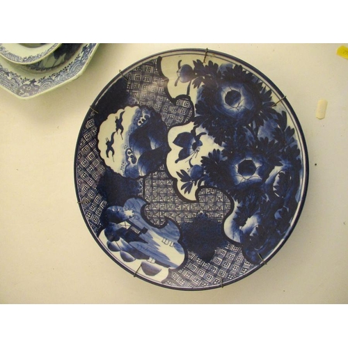 540 - An 18th century Chinese blue and white charger badly AF, together with a dish, a plate decorated wit... 