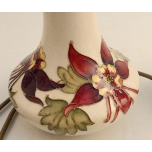 550 - A pair of Moorcroft pottery lamp bases, decorated in the Columbine pattern, height 10ins