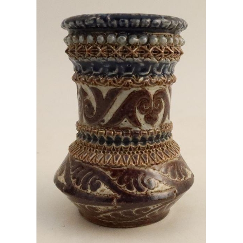 553 - A Martin Ware stoneware vase, with bands of decoration, inscribed R W Martin London 1876 to base, he... 