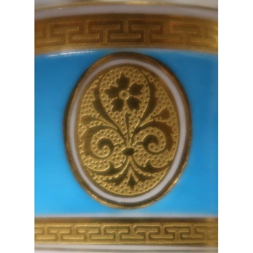 560 - A large Minton cup and saucer, decorated in turquoise and gilt, impressed mark