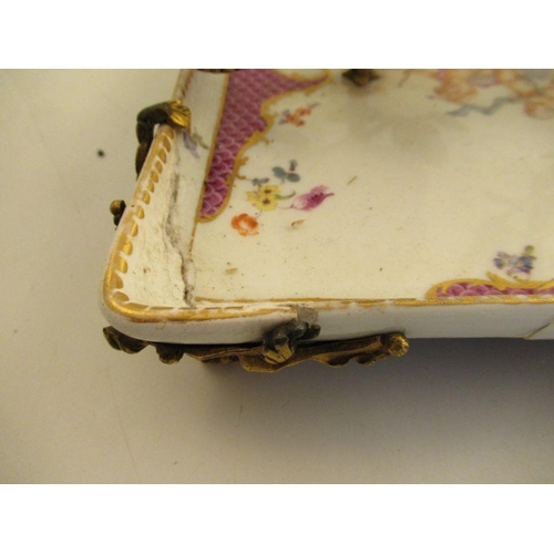 572 - A continental porcelain desk tray with armorial mounts supporting Ink well, pounce pot and a candle ... 