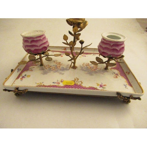 572 - A continental porcelain desk tray with armorial mounts supporting Ink well, pounce pot and a candle ... 