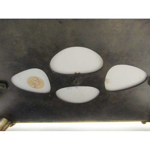 572 - A continental porcelain desk tray with armorial mounts supporting Ink well, pounce pot and a candle ... 