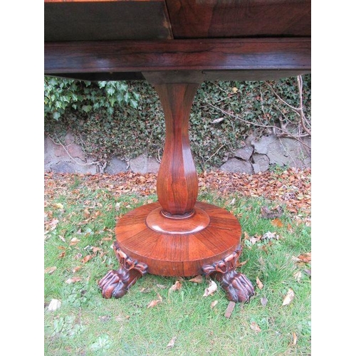 58 - A 19th century rosewood fold over table, width 36ins, height 28ins