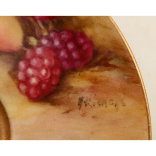 584 - A Royal Worcester cup and saucer, the exterior of the cup and the saucer decorated with fruit to a m... 