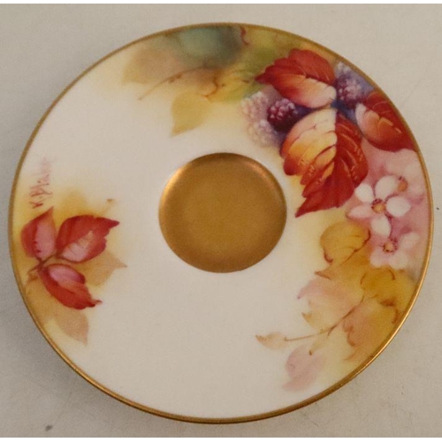 586 - A Royal Worcester cup and saucer, the exterior of the cup and the saucer decorated with autumnal fru... 