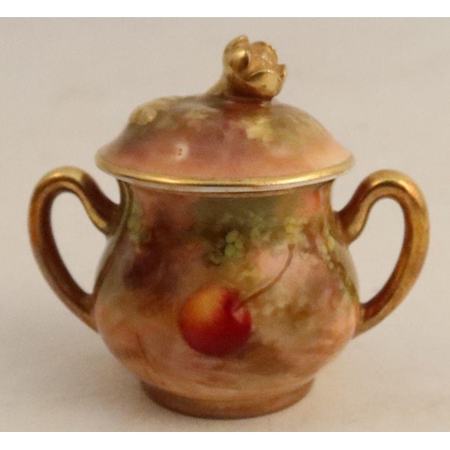 590 - A Royal Worcester miniature covered sugar box, decorated all round with fruit to a mossy background ... 