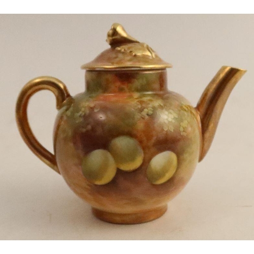 591 - A Royal Worcester miniature teapot, decorated all round with fruit to a mossy background by E Townse... 