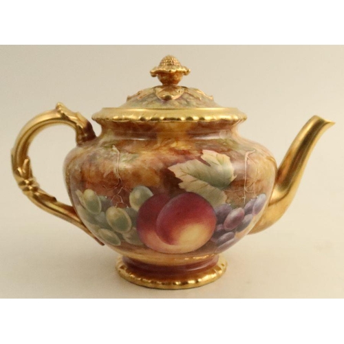 596 - A Royal Worcester teapot, decorated all around with fruit to a mossy background by Skerrett, height ... 