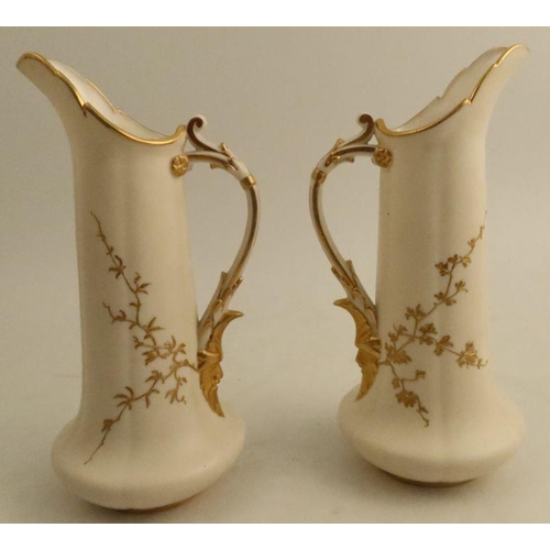 604 - A pair of Graingers Worcester gilded ivory jugs, decorated with a view of Worcester and Stratford-on... 