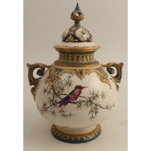 611 - A Hadley's Worcester covered vase, decorated with a bird in foliage, height 9.25ins - - minor gildin... 