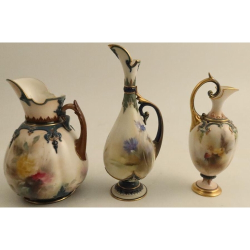 614 - Two Hadley's Worcester and a Royal Worcester Hadley's Ware jugs, decorated with flowers to typical  ... 