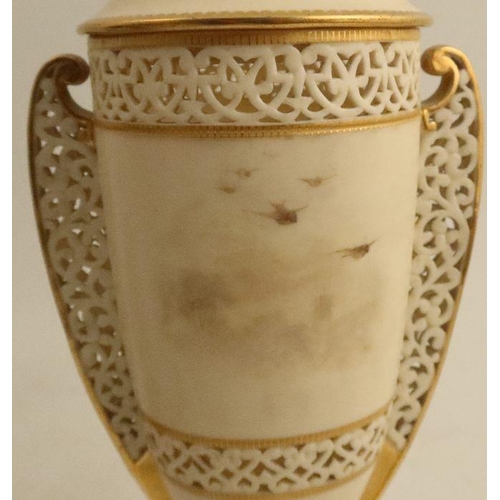 622 - A Graingers Worcester reticulated covered vase, the ivory body decorated with a view of Worcester Ca... 