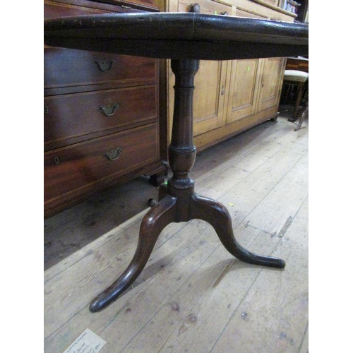 82 - An Antique oak tripod table, width 28ins