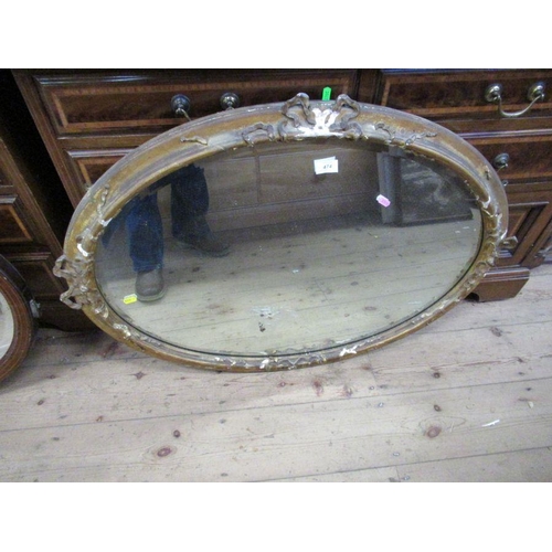 89 - An oval gilt framed mirror