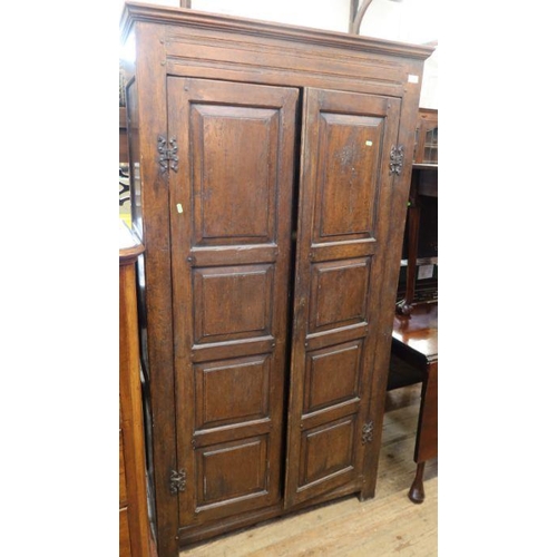 9 - An oak two door hall cupboard, with fielded doors and sides, width 38ins, depth 15ins, height 70.5in... 