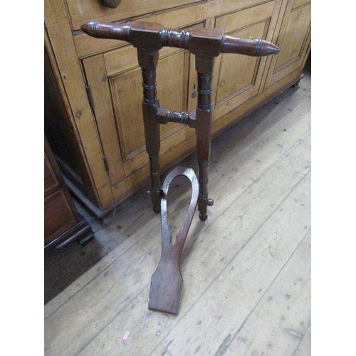 95 - A 19th century mahogany boot jack.