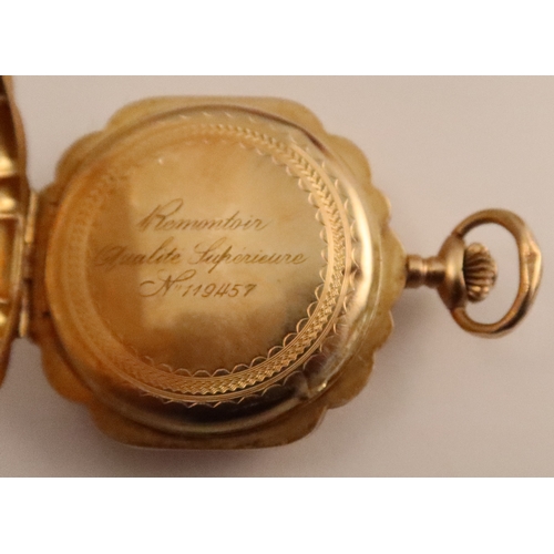 367 - A Continental yellow gold cased fob watch, the front cover inset with an enamel plaque depicting a c... 