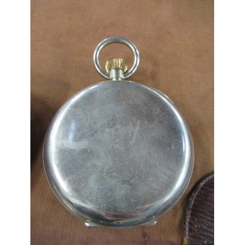 368 - A Goliath pocket watch, together with a silver mounted travel case, dial af