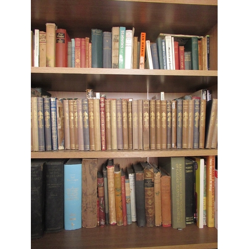 283 - A large collection of books to include Dickens, paper backs etc