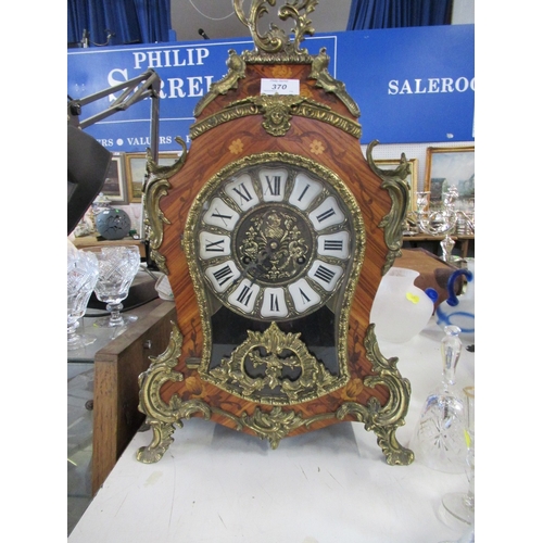 370 - A continental design mantel clock with gilt mount  height 23ins