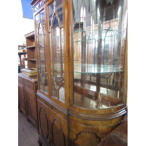 69 - A bow front display cabinet