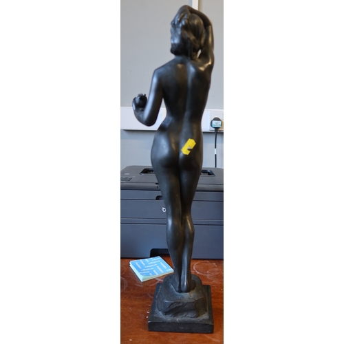 224 - A bronze figure of Eve, nude holding apple and raised on a pedestal height, titled temptation 20ins