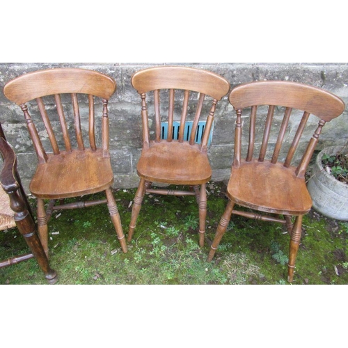 15 - A ladder back armchair, together with 3 kitchen chairs