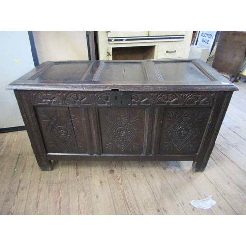 17 - An Antique oak coffer, 3 fielded panels to the top and 3 fielded panels to side with carved decorati... 