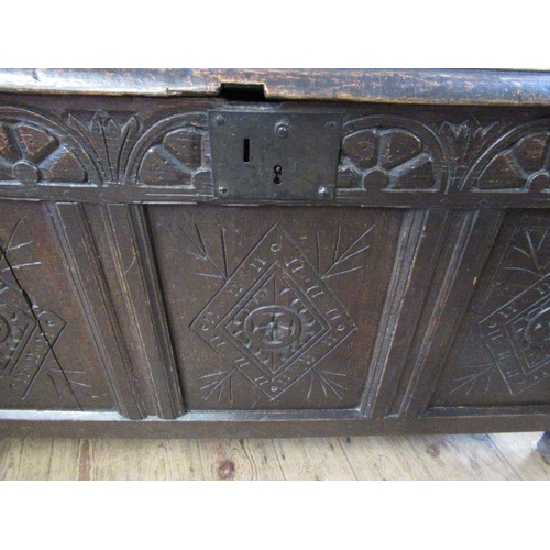 17 - An Antique oak coffer, 3 fielded panels to the top and 3 fielded panels to side with carved decorati... 