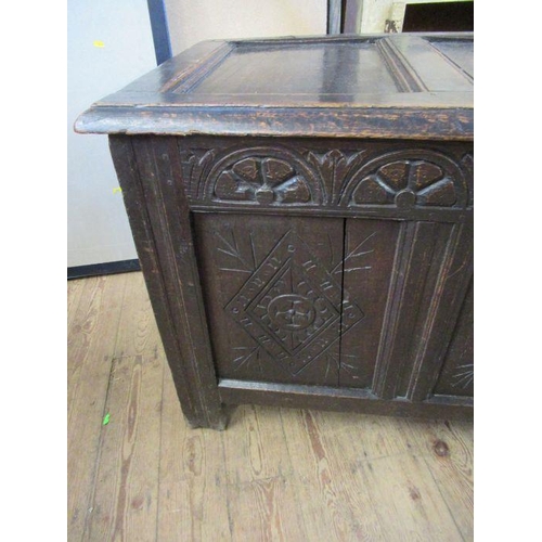 17 - An Antique oak coffer, 3 fielded panels to the top and 3 fielded panels to side with carved decorati... 