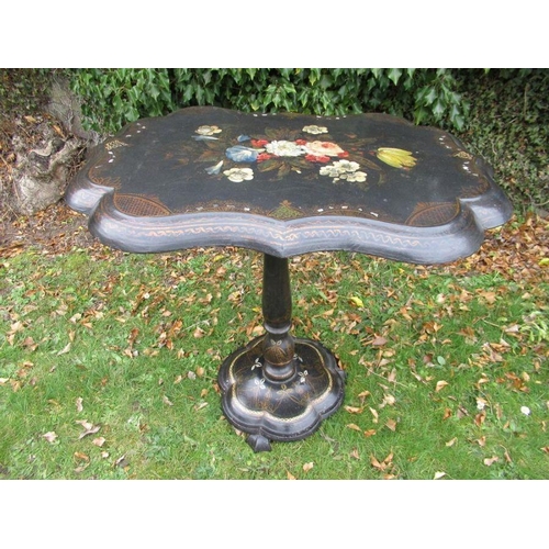 36 - A Victorian paper mache tilt top table, heavily painted and inlaid gilt decoration, width 29ins, hei... 