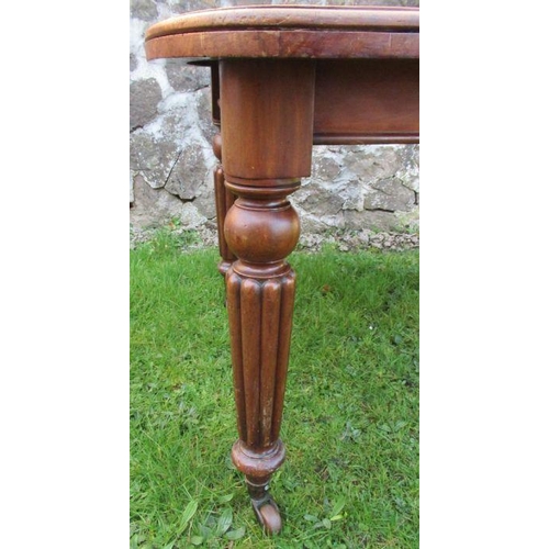 45 - A 19th century dining table with reeded legs, 52ins x 41ins, height 29ins